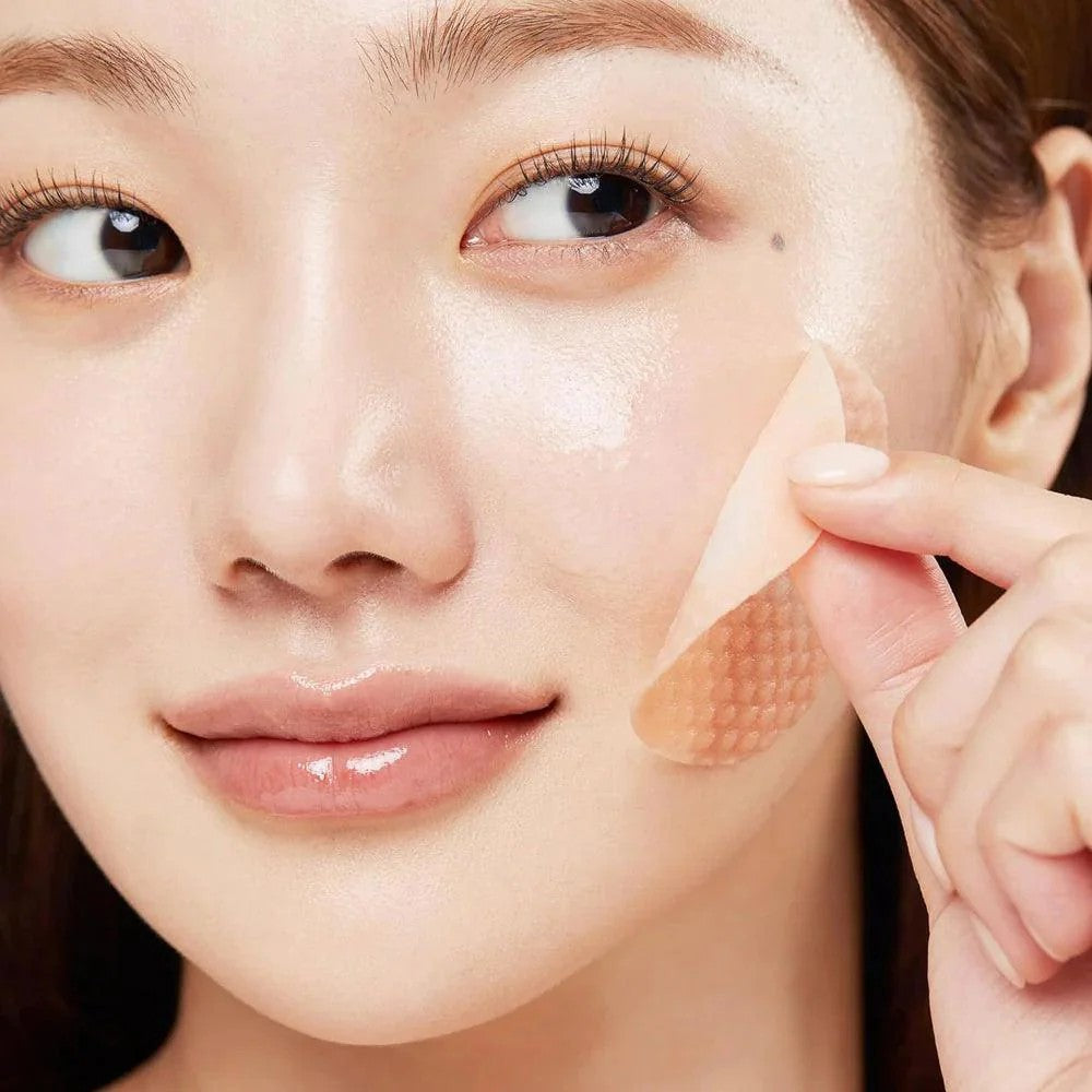 How to use Medicube Red Succinic Acid pads — gently swipe pad across face to exfoliate and reduce oil