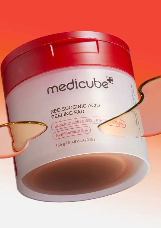 Open jar showing Medicube Red Succinic Acid pads inside (70pcs) — pre-soaked toner pads for pore care