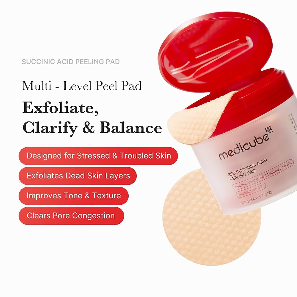 Close-up of a Medicube Red Succinic Acid peeling pad — soft texture soaked in exfoliating toner