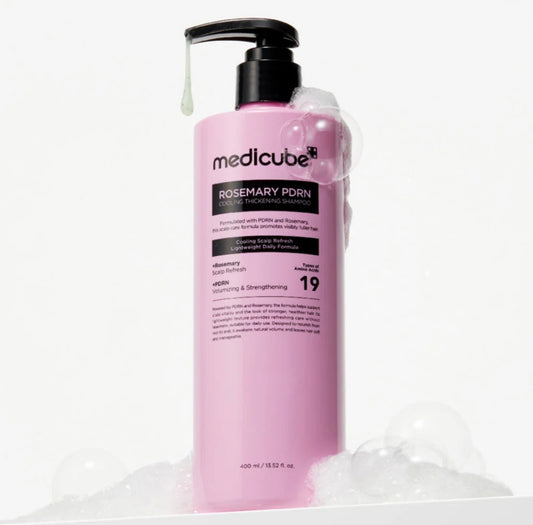Front view of Medicube Rosemary PDRN Hair Loss Relief shampoo and treatment bottles with refreshing mint-green labels.