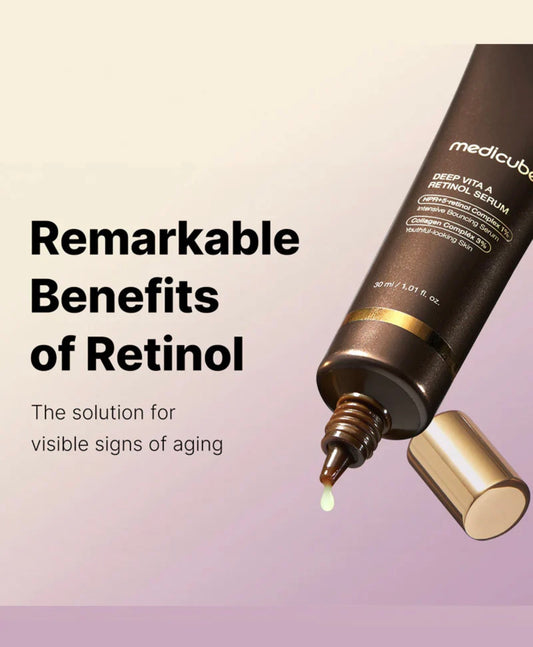 Dropper dispensing a small clear serum drop — texture of Medicube Vita A retinol serum.