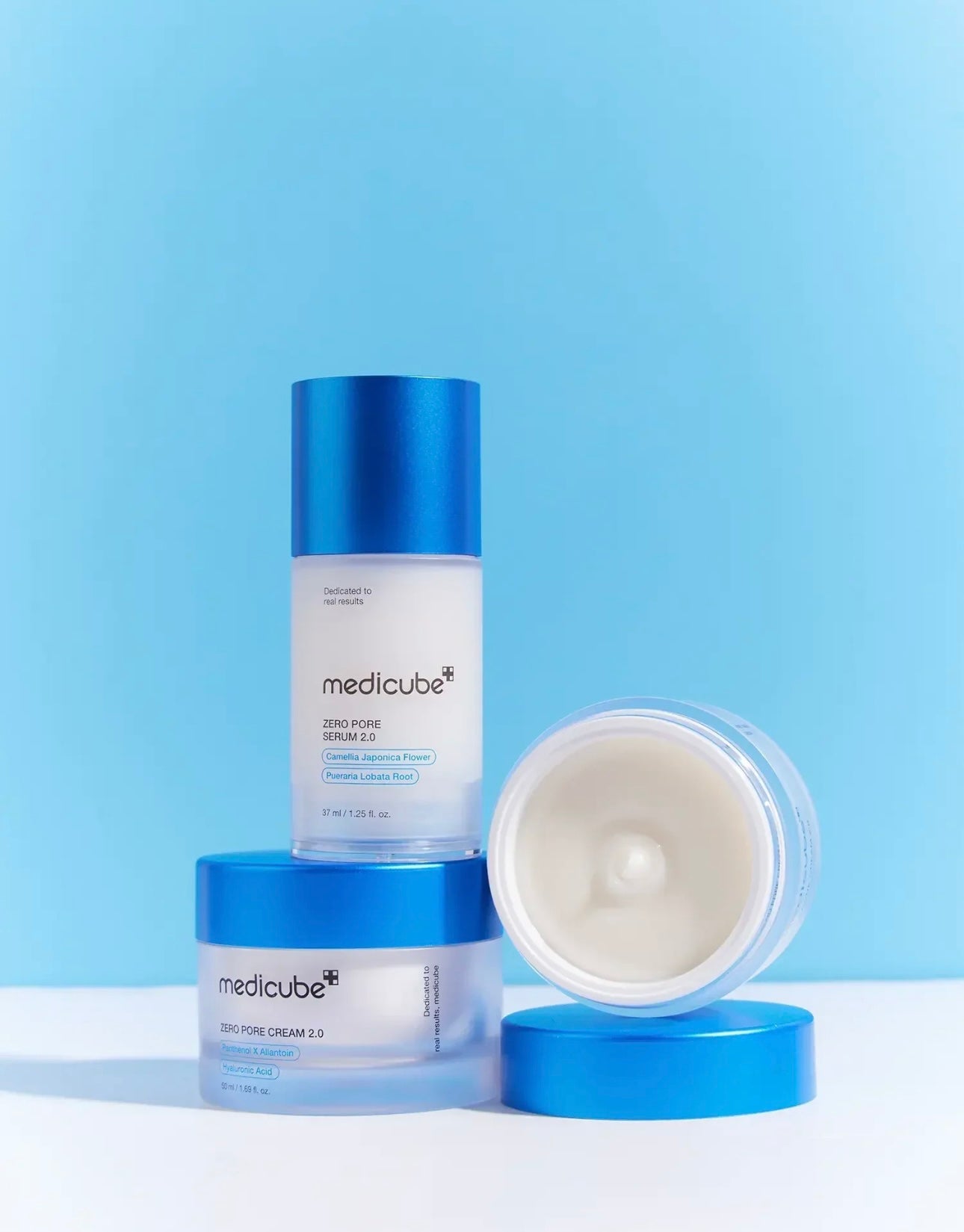 Close up of the lightweight milky texture of Medicube Zero Pore Serum 2.0 applying on skin.