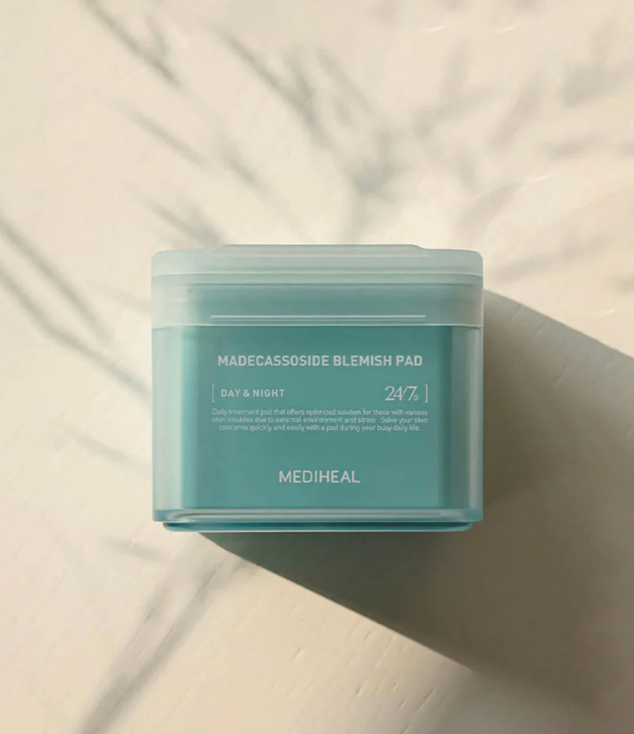 Textured gauze side of the Mediheal Madecassoside pad designed for gentle physical exfoliation and smoothing skin texture.