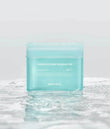 Mediheal Madecassoside Blemish Pad 100pcs jar sitting on a clean vanity next to the included plastic tweezers.