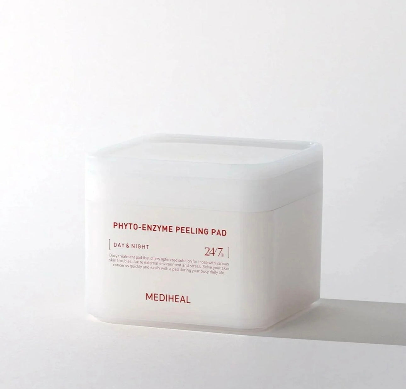 Close up of the Mediheal Phyto Enzyme Pad essence texture showing clear serum on fingertips.