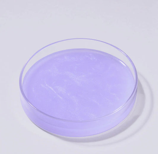 Applying numbuzin no 9 nad pdrn glow boosting toner on skin showing its watery texture for easy absorption.