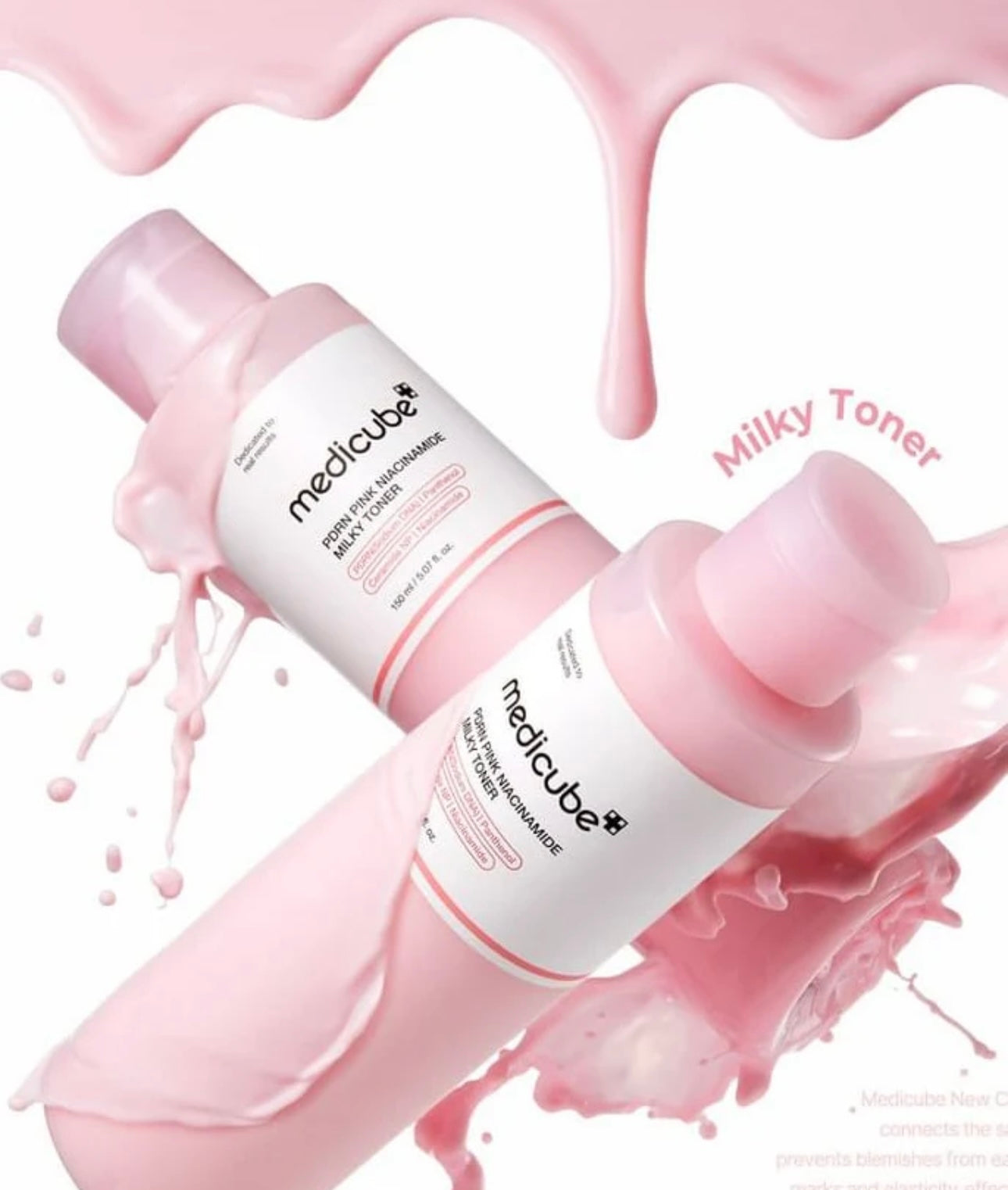 Close up showing the milky texture of PDRN pink niacinamide milky toner dropping on skin.
