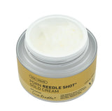 A pea-sized amount of the PDRN Reedle Shot Gold Cream on skin, showing the rich golden cream texture