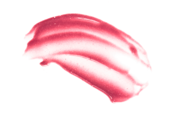 Pink lip balm swatch on a white background