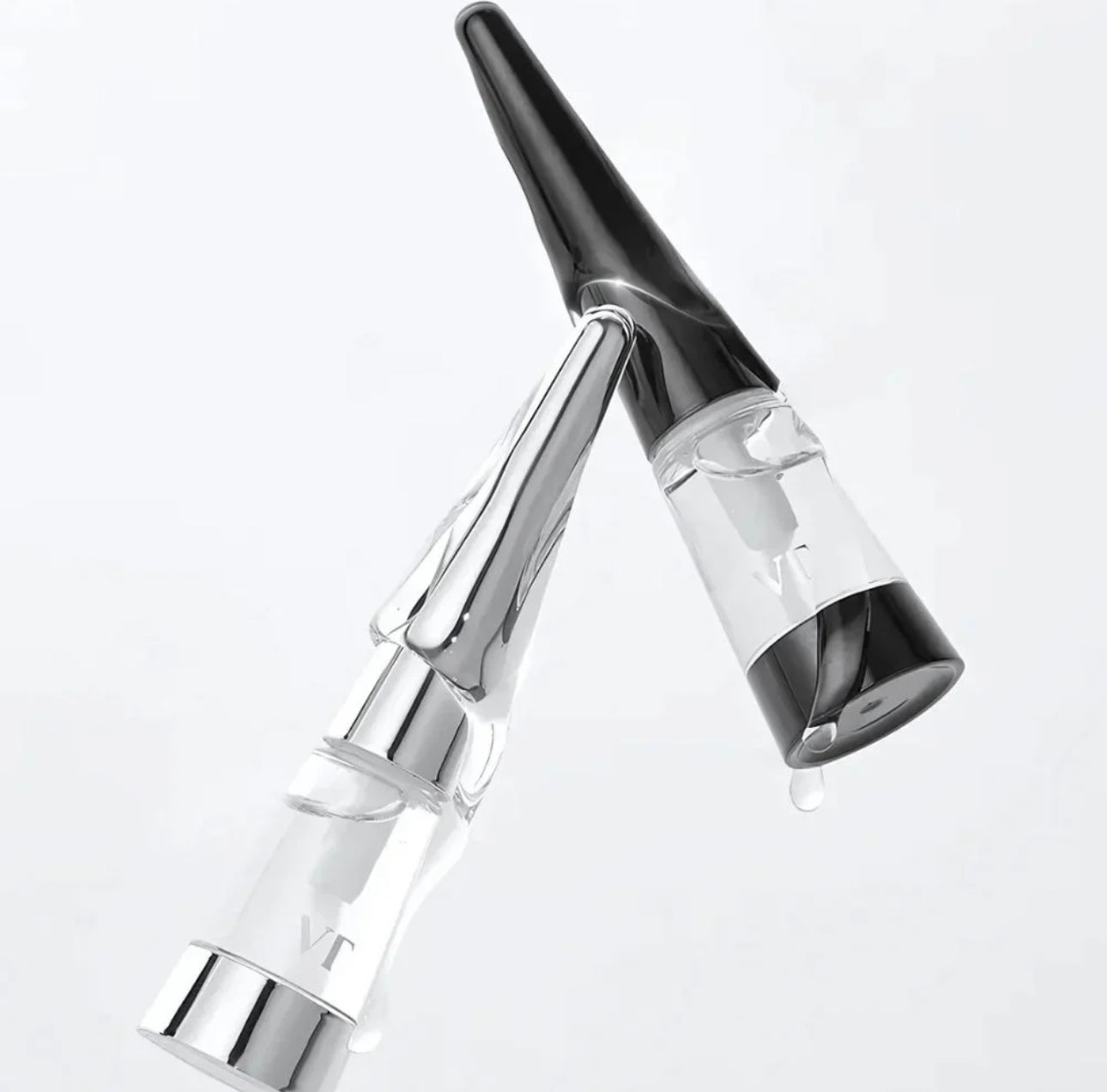 A close-up of the Reedle Shot Lip Plumper Expert applicator and sleek bottle design.