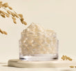 A close-up swatch showing the unique gel cream texture with visible rice ceramide capsules blending on the skin.