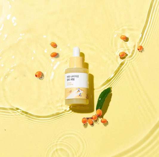A person enjoying the soothing, non-sticky feel of the Round Lab Vita Niacinamide Serum.