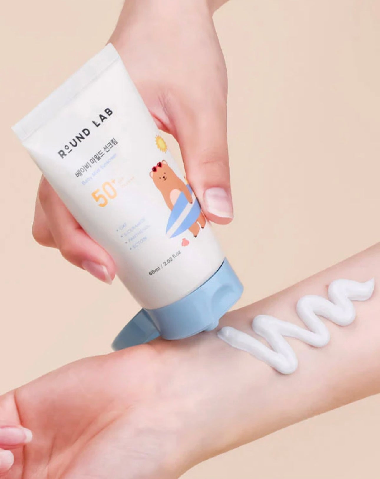 Lightweight texture of Round Lab Baby Mild Sun Cream SPF 50 PA on finger