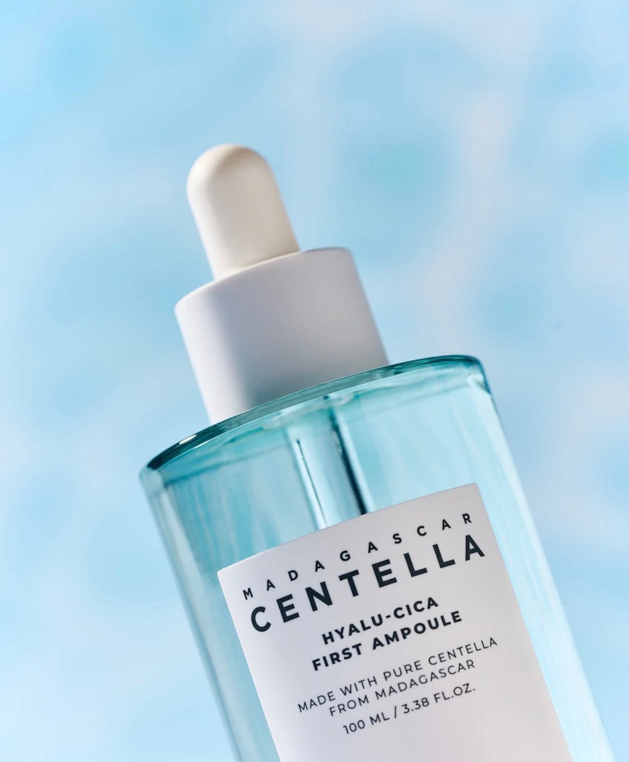 Watery texture of the SKIN1004 cica ampoule dropping from the pipette, showing its lightweight consistency