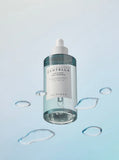 Applying SKIN1004 Hyalu Cica ampoule evenly onto glowing skin, promoting absorption and radiance