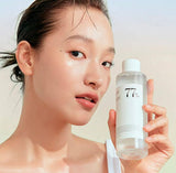 Conceptual image showing calm, hydrated, and clear skin as a result of using the Anua Heartleaf 77% Soothing Toner.