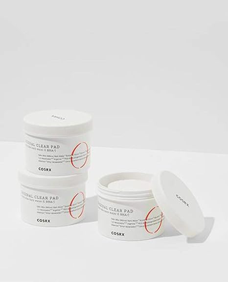 Using a cosrx clear pad to swipe across the face, the cosrx original clear pad helps remove impurities.