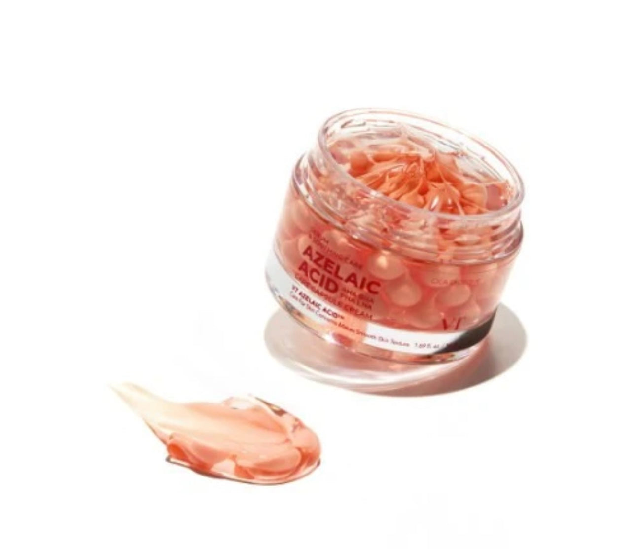 Swatch of VT Cosmetics Azelaic Acid Care Capsule Cream showing visible pink azelaic acid care capsules within the soothing gel formula on a clean surface.