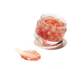 Swatch of VT Cosmetics Azelaic Acid Care Capsule Cream showing visible pink azelaic acid care capsules within the soothing gel formula on a clean surface.