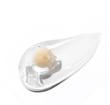 Macro shot of the VT cosmetics rice ceramide capsule bursting to release nourishing moisture and ceramides.